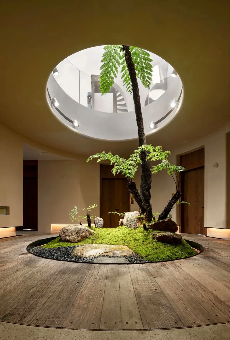 A circular skylight and planted interior courtyard at Meiluo Wumingchu in Suzhou
